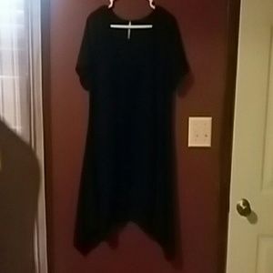 Short sleeved black dove tailed flowy top.